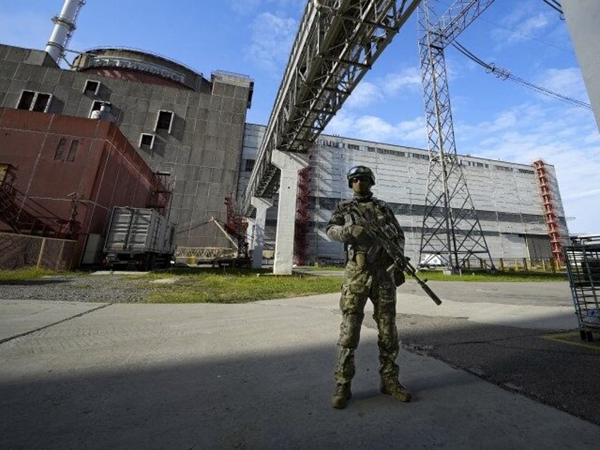 FILE - A Russian serviceman guards in an area of the Zaporizhzhia Nuclear Power Station in