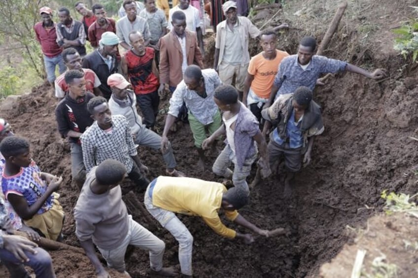 Volunteers dug in the mud for survivers