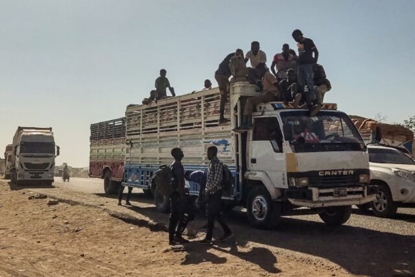 Displaced people fleeing from al-Jazirah state arrive in Gedaref in the east of war-torn Sudan on December 22, 2023