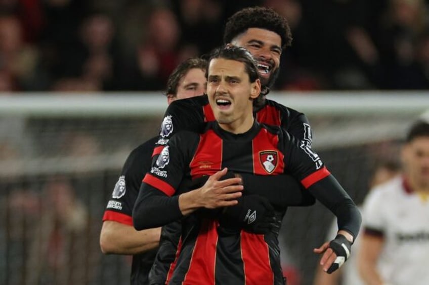 Bournemouth's Enes Unal (C) celebrates scoring against West Ham