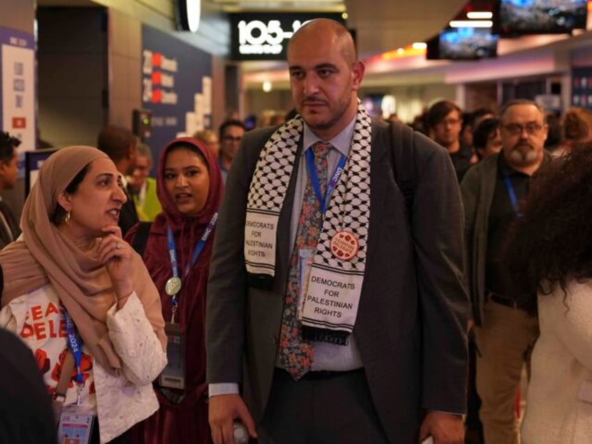 CHICAGO, ILLINOIS - August 20: Abbas Alawieh, cofounder of the uncommitted movement, walks