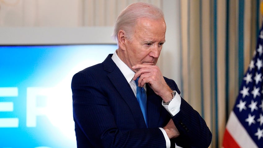 Biden's hand on his face