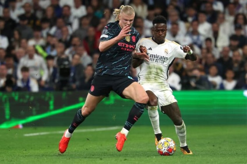 Erling Haaland (left) has been criticised for his hold up play in recent weeks