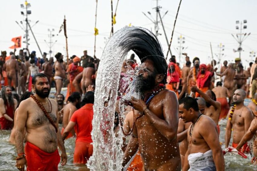 Swarming throngs of devotees bathed in rivers at the world's biggest religious gathering i