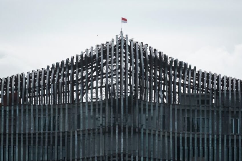 The Indonesian flag flutters atop the Presidential Palace complex in the future capital ci