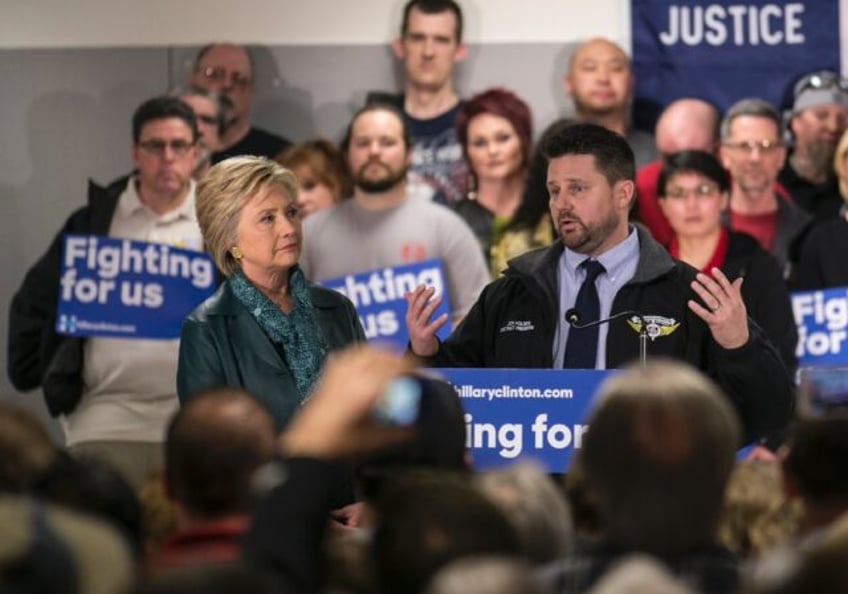 Jon Holden -- seen here with Hillary Clinton in March 2016 -- is president of the Internat