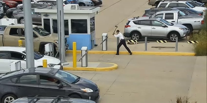 united airlines pilot caught on video taking ax to parking barrier