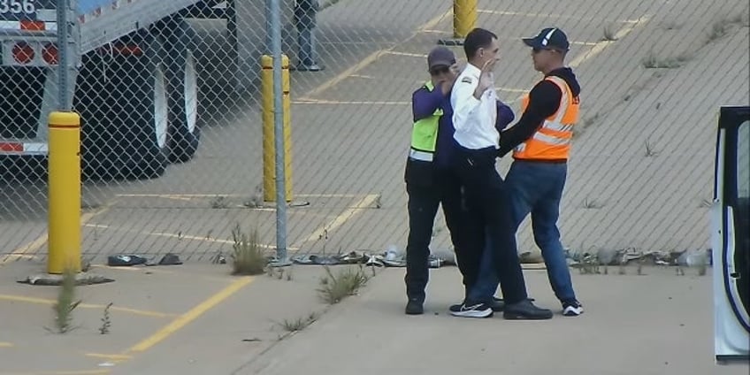 united airlines pilot caught on video taking ax to parking barrier