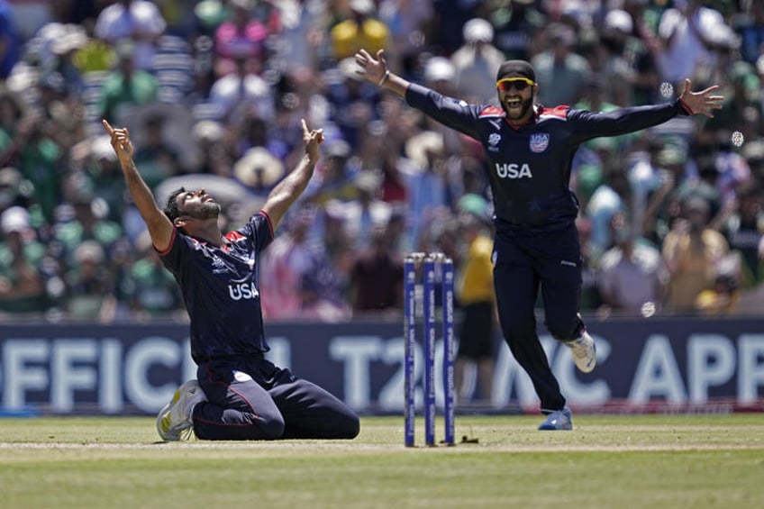 United States' Saurabh Nethralvakar, left, celebrates after their win in the ICC Men's T20 World Cup cricket match against Pakistan at the Grand Prairie Stadium in Grand Prairie, Texas, Thursday, June 6, 2024. (AP Photo/Tony Gutierrez)