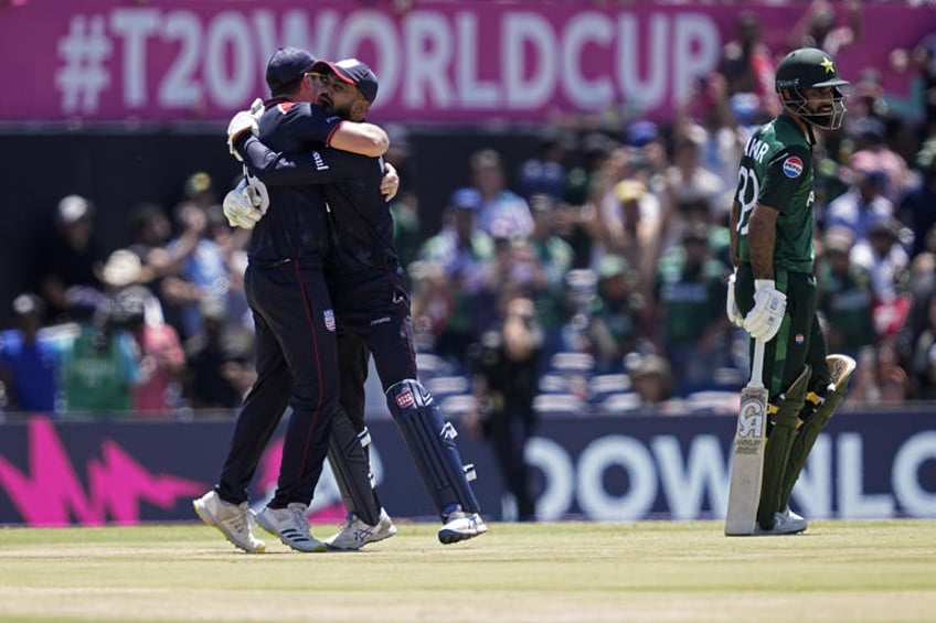 United States' captain Monank Patel, center, celebrates with a teammate after their win in the ICC Men's T20 World Cup cricket match against Pakistan at the Grand Prairie Stadium in Grand Prairie, Texas, Thursday, June 6, 2024. (AP Photo/Tony Gutierrez)