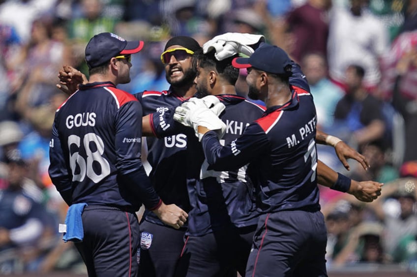 United States' Muhammad Ali-Khan, second right, celebrates with teammates after the dismissal of Pakistan's Fakhar Zaman during the ICC Men's T20 World Cup cricket match between United States and Pakistan at the Grand Prairie Stadium in Grand Prairie, Texas, Thursday, June 6, 2024. (AP Photo/Tony Gutierrez)