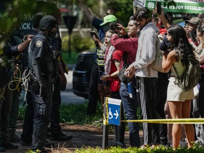 Protesters confront police officers during a pro-Palestinian protest at Emory University o