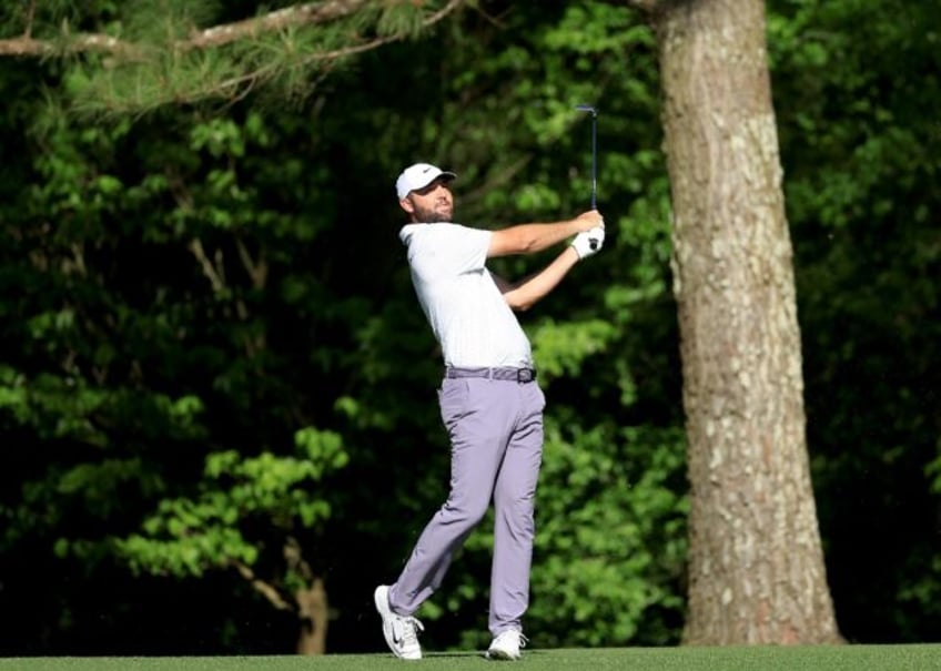 Scottie Scheffler of The United States plays his second shot on the 11th hole during the t