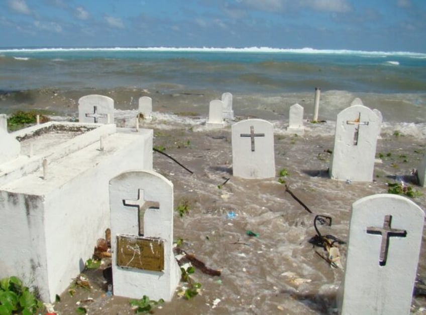 A cemetery on Majuro Atoll is flooded by high tides and ocean surges in the low-lying Mars