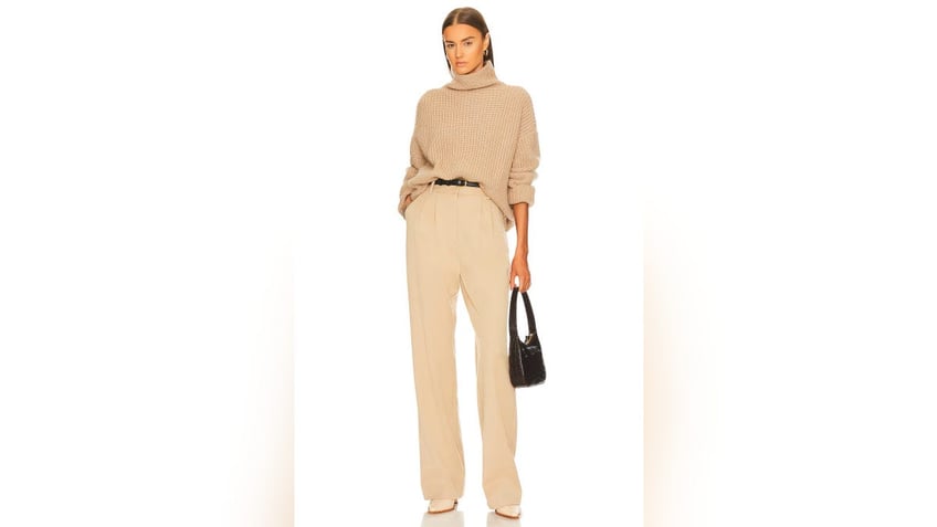 Beige trousers are a must-have hue to complement your white and cream tops this winter 2024.