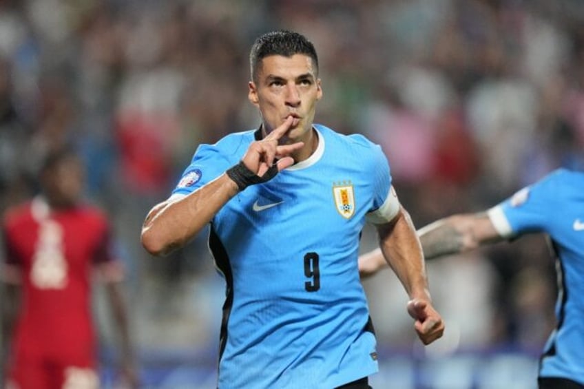 Uruguay's Luis Suarez celebrates his injury-time equaliser in the Copa America third place