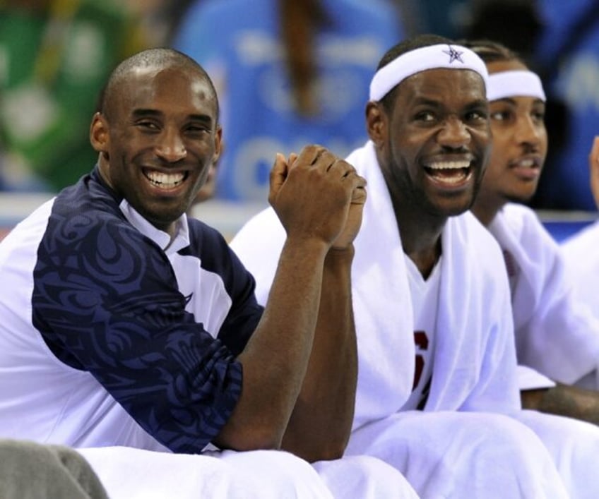 The late Kobe Bryant, left, and LeBron James share a laugh at the 2008 Beijing Olympics as part of the US gold medal squad that was a first-time nominee for the Basketball Hall of Fame