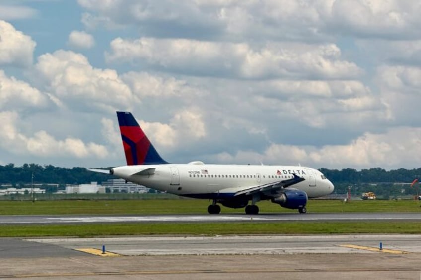 A Delta Airlines plane takes off from Washington Reagan National Airport in Arlington, Vir