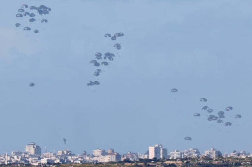 The pallets of humanitarian aid being airdropped into northern Gaza