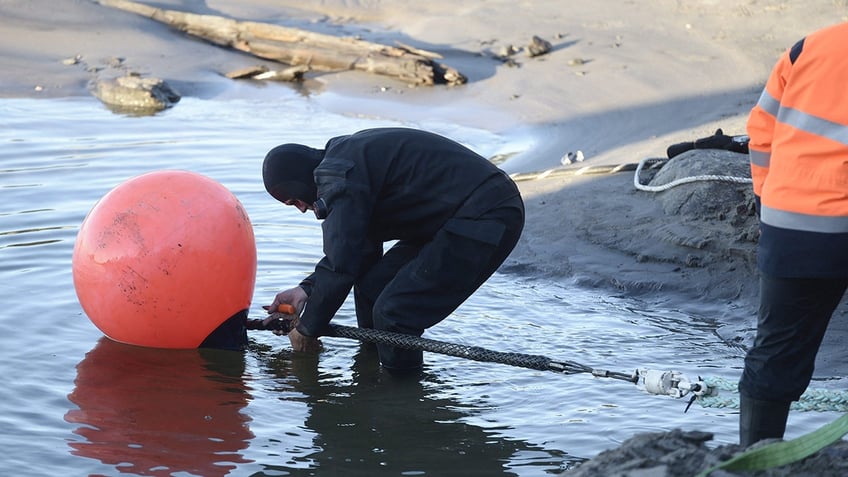 Cable being laid underwater in Baltic Sea