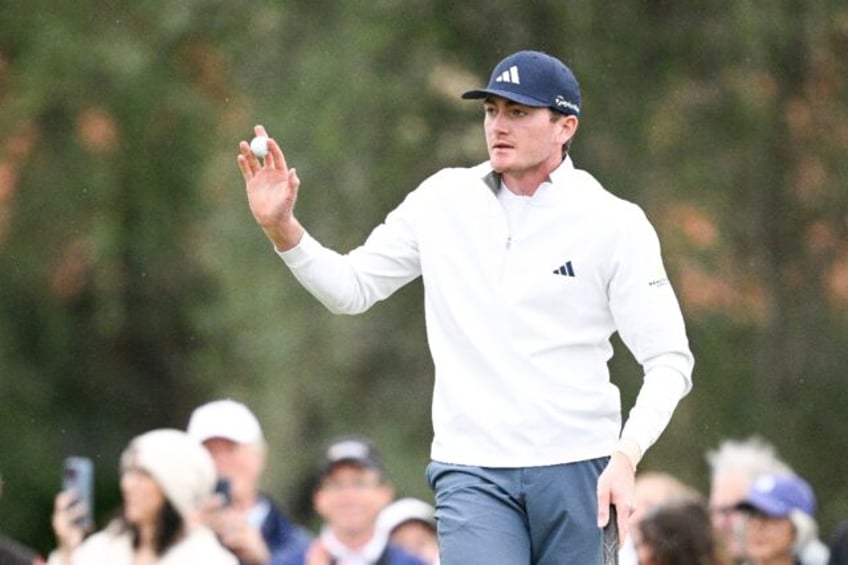 American 20-year-old Nick Dunlap, trying to become the first amateur to win a US PGA Tour event since 1991, waves to the crowd after taking a three-stroke lead following the third round of the American Express tournament