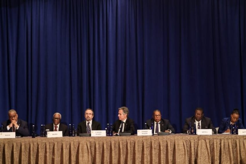 President of the Haitian Transitional Presidential Council Edgard Leblanc Fils (2L) speaks