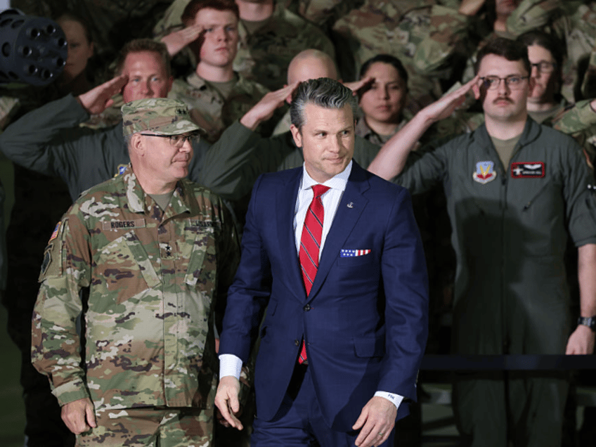 SELFRIDGE ANGB, MICHIGAN - APRIL 29: Defense Secretary Pete Hegseth listens as President D