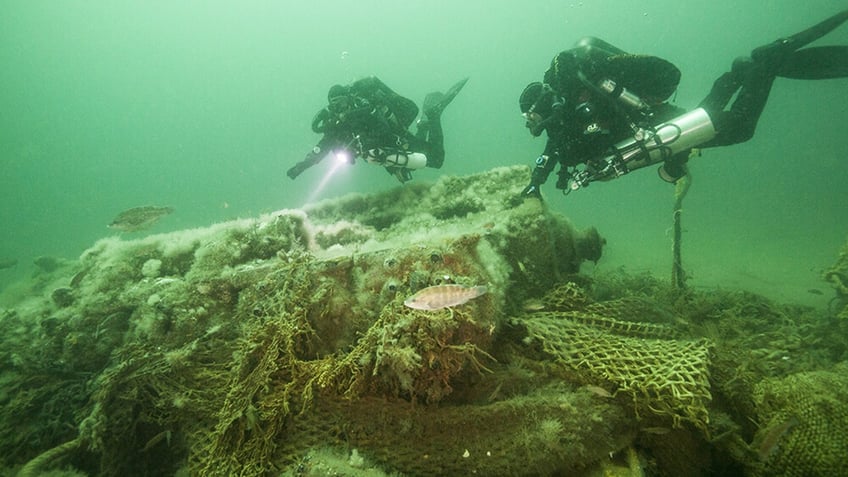 Divers explore the WWII minesweeper USS Heroic off the coast of Massachusetts. 