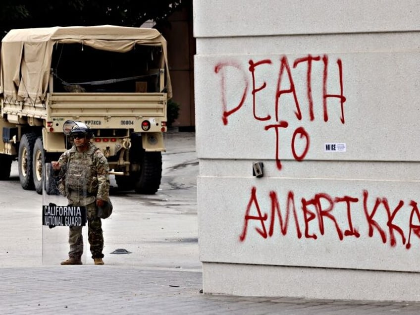 Los Angeles, CA - June 09: National Guard stands watching in front of the Edward R. Roybal