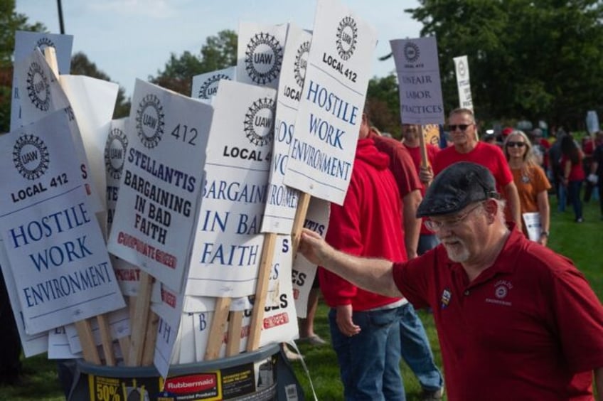 us auto workers union expands strike at general motors stellantis