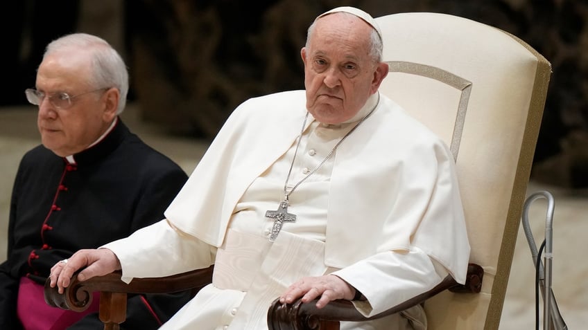 Pope Francis sitting