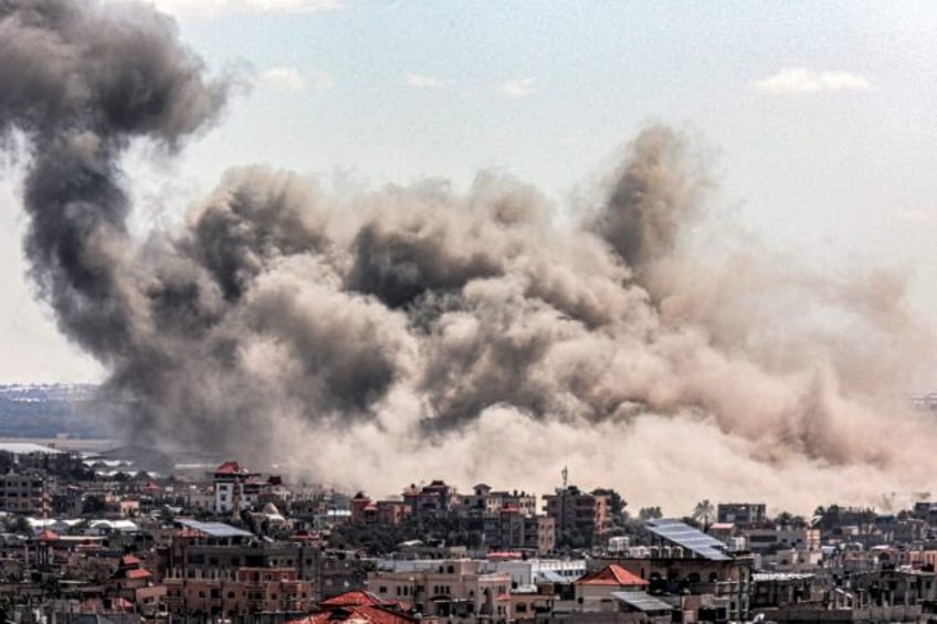 Smoke billows over Rafah in the south of Gaza after an Israeli bombardment during its war