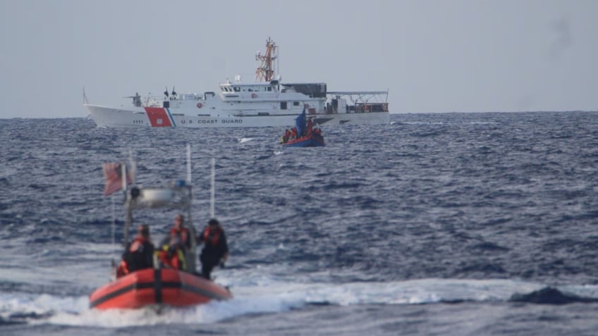 US Coast Guard ships intercepting immigrant boats heading towards the US.