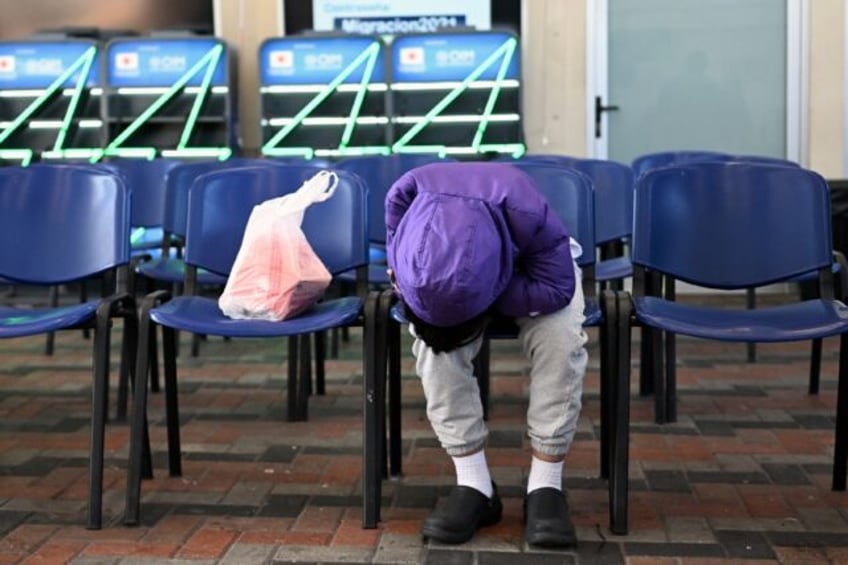 A Guatemalan migrant deported from the United States waits at the Returnee Reception Cente