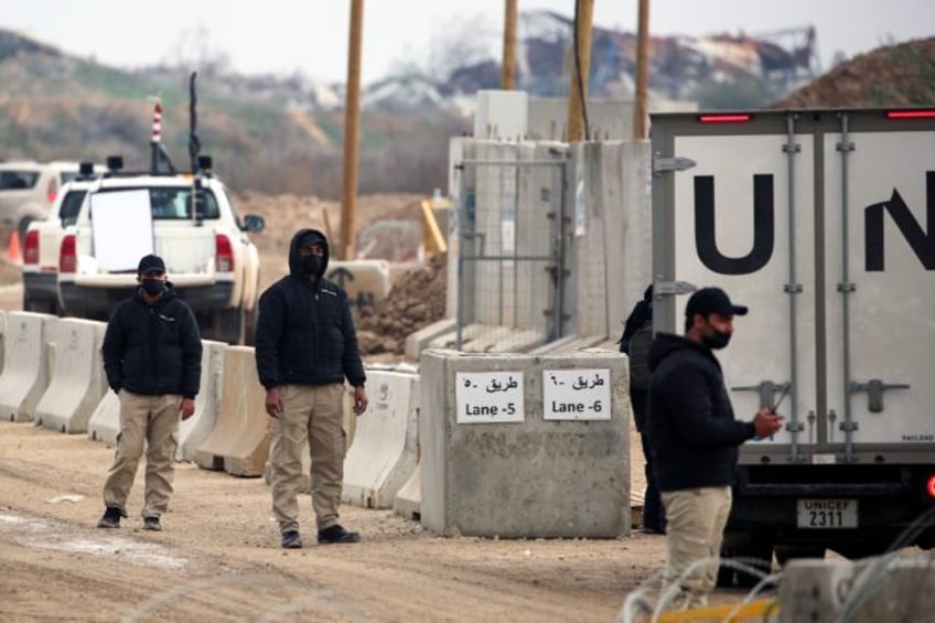 UN vehicles cross a checkpoint manned by Egyptian and US security on the Netzarim Corridor