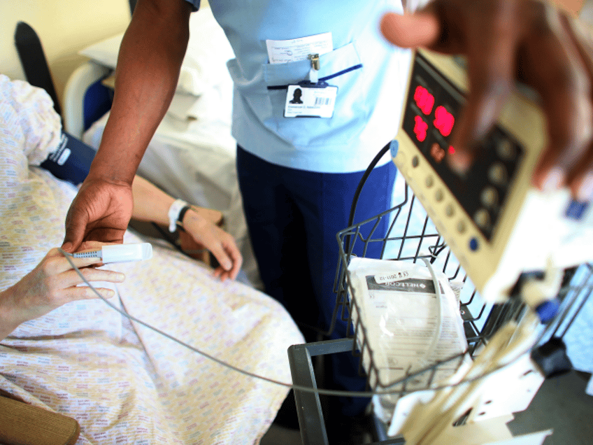 BIRMINGHAM, ENGLAND - MARCH 16: A nurse tends to recovering patients on a general ward at The Queen Elizabeth Hospital on March 16, 2010 in Birmingham, England. As the UK gears up for one of the most hotly contested general elections in recent history it is expected that that the …