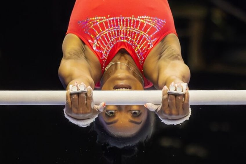 Simone Biles trains on the uneven bars ahead of the US Olympic gymnastics trials