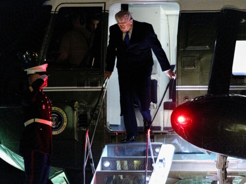 US President Donald Trump disembarks Marine One on the South Lawn of the White House in Wa