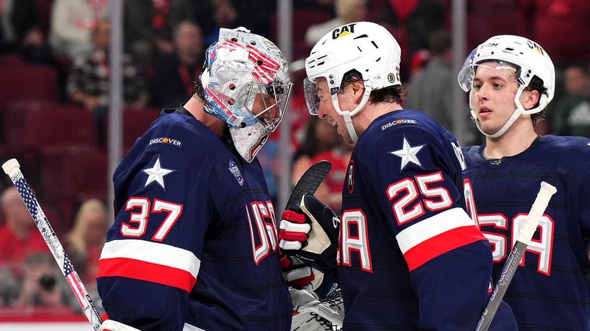 Charlie McAvoy and Connor Hellebuyck