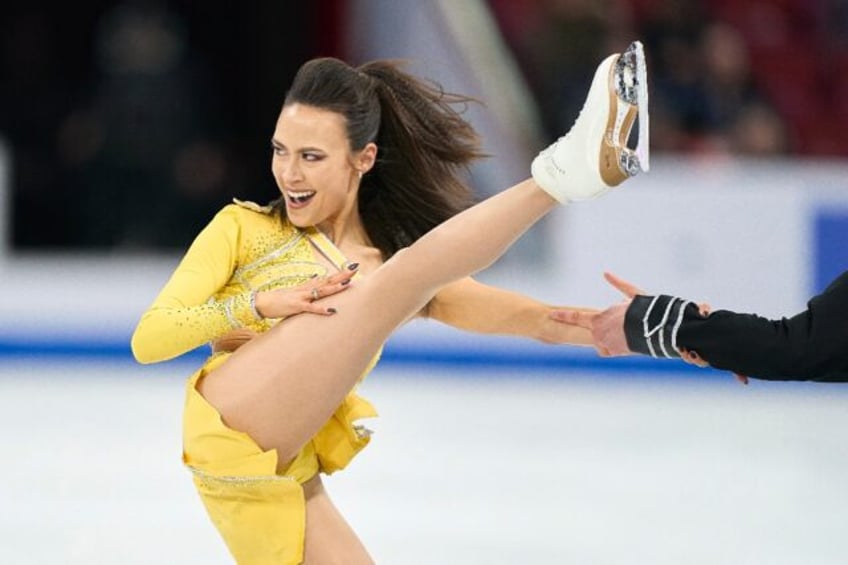 Madison Chock, shown holding onto the hand of partner Evan Bates, performs in the rhythm d