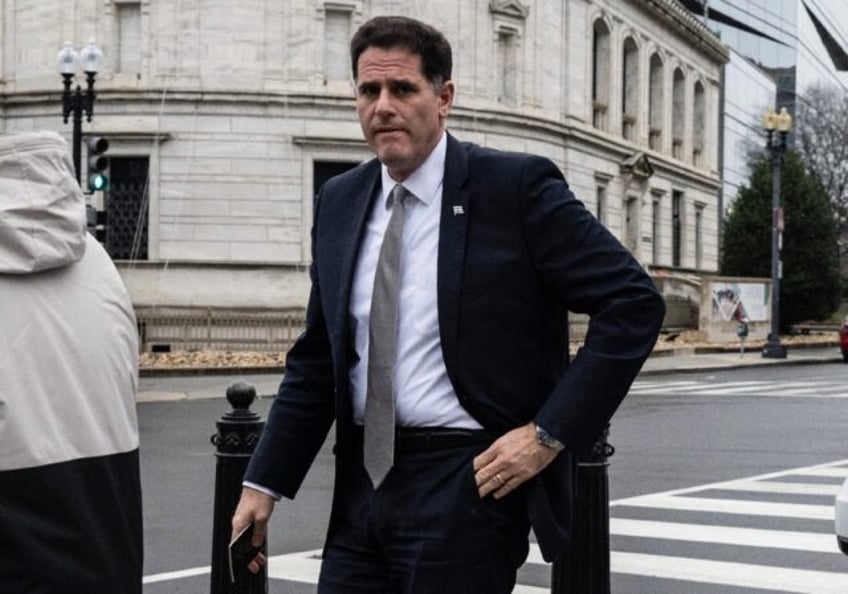 Israel's Minister for Strategic Affairs Ron Dermer walks into the Executive Office Building next to the White House on Tuesday