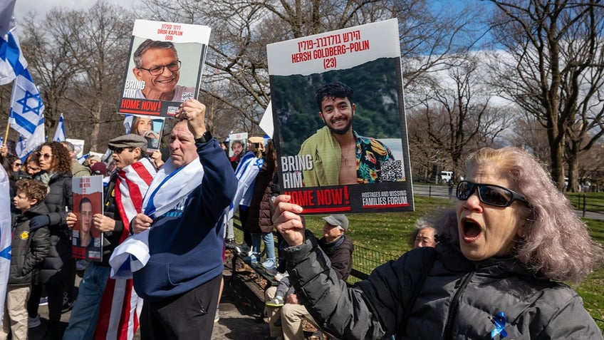 New York protesters hold posters of Israeli hostages held by Hamas