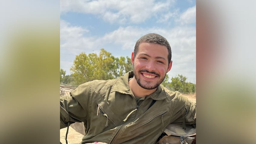 Italy seen smiling while wearing an IDF uniform