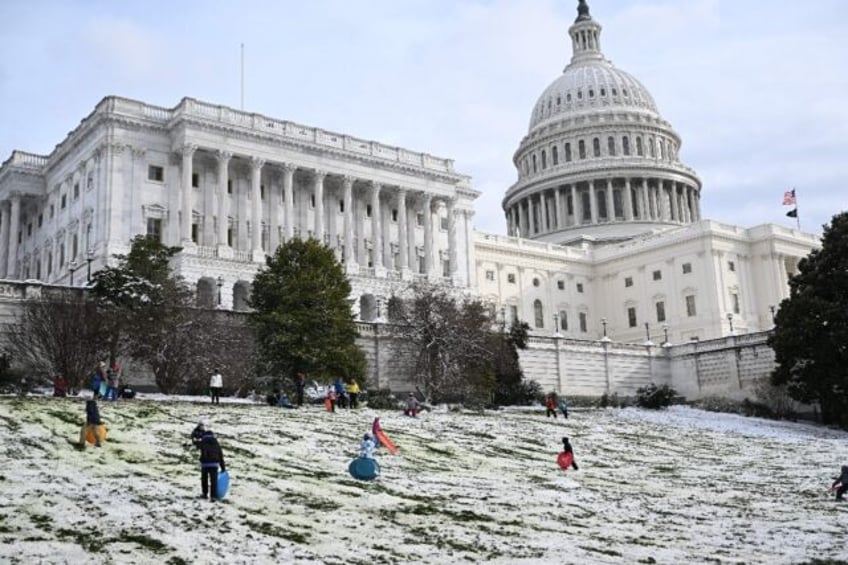 The US Congress was racing to keep the federal government funded -- but snow threatened to disrupt lawmakers' travel plans