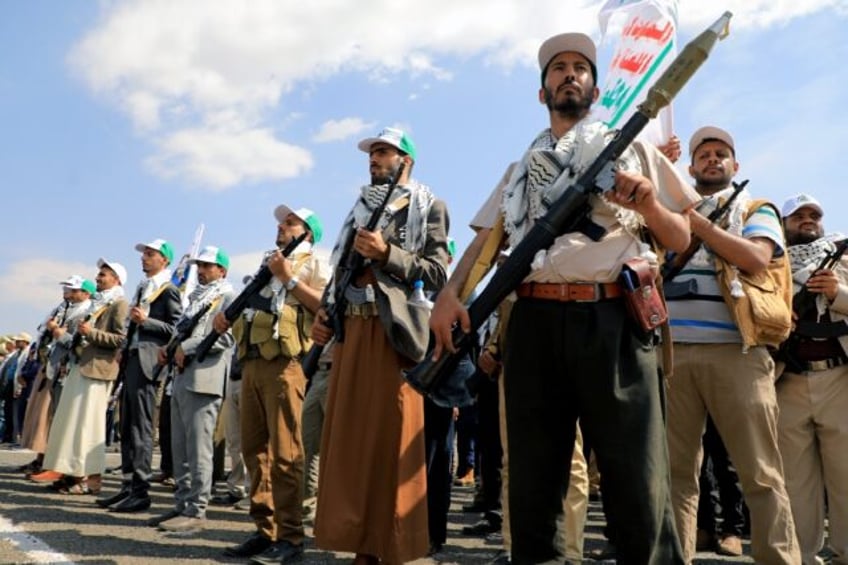 Yemenis take part in a parade in the Huthi-run capital Sanaa on March 9