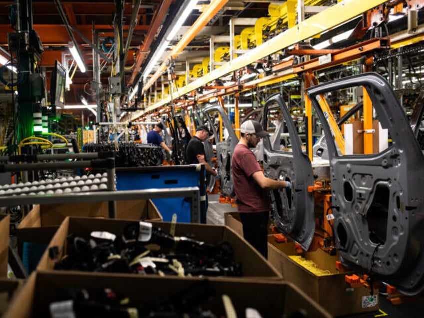Workers assemble vehicle doors at the General Motors assembly plant in Fort Wayne, Indiana