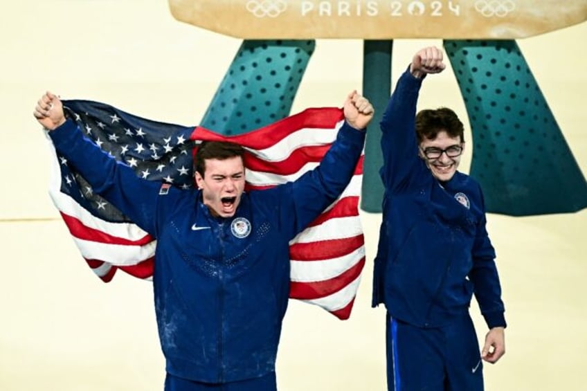 Brody Malone and Stephen Nedoroscik celebrate after the USA landed bronze in the Olympic m