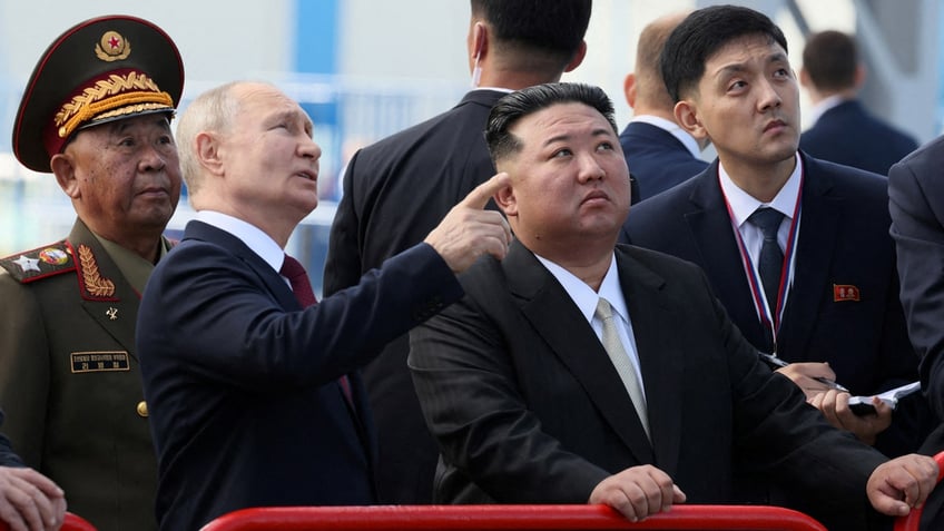 Vladimir Putin and Kim Jong Un