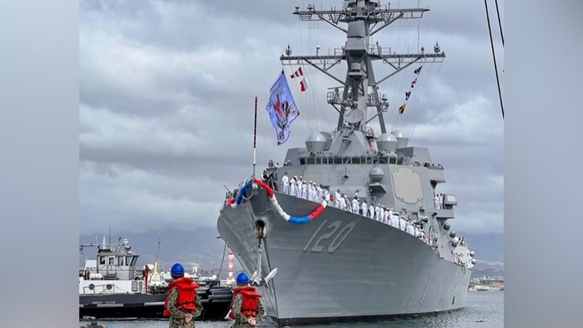 us navy destroyer sports badass pirate inspired flag during pearl harbor homecoming pictures