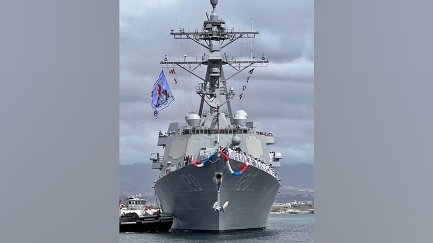 us navy destroyer sports badass pirate inspired flag during pearl harbor homecoming pictures